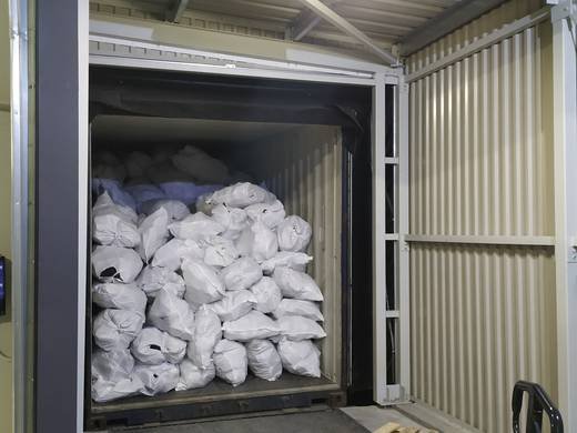 TFN Ventures 25kg bags of used shoes loaded into export container 7